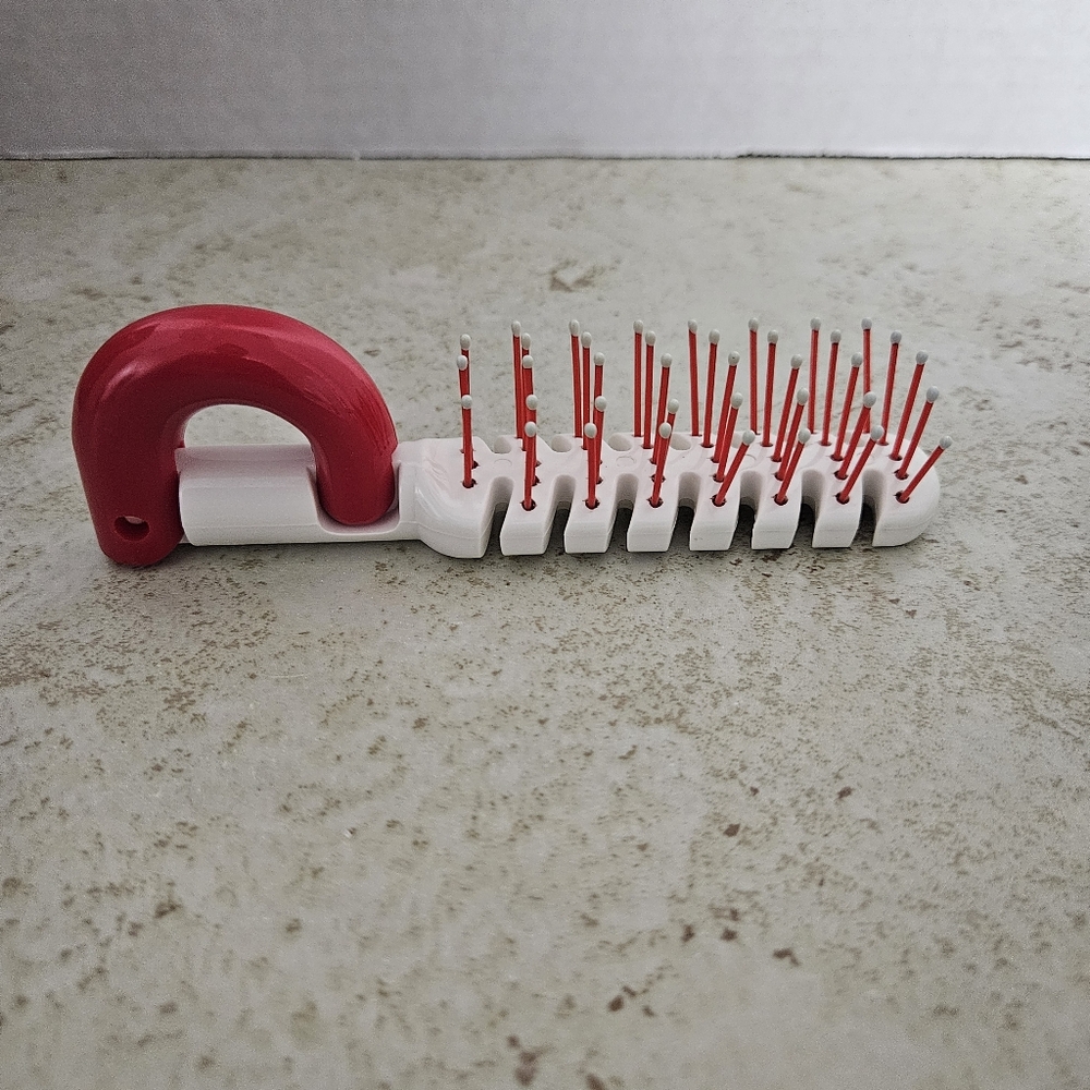 Phillips Korea red and white vented hair brush.